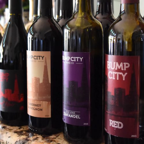 Line-up of Bump City wine bottles